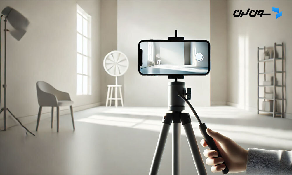 Person recording video with a smartphone on a tripod in a minimalistic studio.